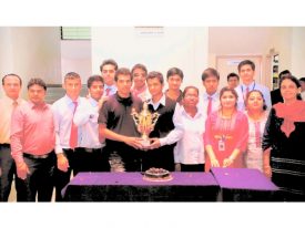 sports winners Faculty and students with the football trophy